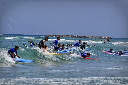 Surfing in Tel Aviv by Flickr user werkunz1